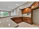 Basement kitchen featuring a bar with countertop and wood cabinets at 6610 Royal Oakland Dr, Indianapolis, IN 46236