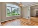 The living room has hardwood floors, base trim, and a chandelier at 6610 Royal Oakland Dr, Indianapolis, IN 46236