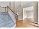 The living room boasts a large window and gleaming hardwood floors at 6610 Royal Oakland Dr, Indianapolis, IN 46236