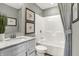Well-lit bathroom with a shower-tub combo, framed art and a stylish vanity at 6702 Halsey St, Zionsville, IN 46077
