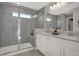 Main bathroom featuring glass-enclosed shower and double sink vanity at 6702 Halsey St, Zionsville, IN 46077