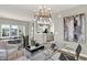Bright, open office space adjacent to kitchen and dining area, with modern chandelier at 6702 Halsey St, Zionsville, IN 46077
