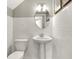 This powder room offers a pedestal sink, subway tiles, and an oval mirror at 6702 Halsey St, Zionsville, IN 46077