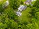 Aerial view of the home and lush green property surrounded by mature trees at 7482 W Us Highway 40, Indianapolis, IN 46229