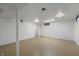 Unfinished basement with concrete walls, painted white, and concrete floor provides a blank canvas for customization at 7482 W Us Highway 40, Indianapolis, IN 46229
