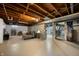 Finished basement featuring comfortable seating, neutral carpet, and exposed ceiling beams at 7482 W Us Highway 40, Indianapolis, IN 46229
