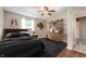 Cozy bedroom with dark decor and wooden floors at 7482 W Us Highway 40, Indianapolis, IN 46229