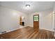 Dining room with hardwood floors, light walls, and natural light at 7482 W Us Highway 40, Indianapolis, IN 46229