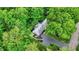 Aerial view of this single Gathering property showing lush tree coverage, the driveway, and manicured lawn at 8641 Cholla Rd, Indianapolis, IN 46240