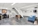 Basement view features gray floors, a finished staircase, and office space at 8641 Cholla Rd, Indianapolis, IN 46240