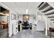 Basement office featuring gray floors, stairs, and a work area at 8641 Cholla Rd, Indianapolis, IN 46240