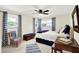 Charming bedroom features bright windows, a cozy chair, and stylish blue and white accents at 8641 Cholla Rd, Indianapolis, IN 46240