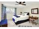 Bright bedroom featuring natural light, ceiling fan, and wood furnishings at 8641 Cholla Rd, Indianapolis, IN 46240