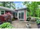 Charming red home with surrounding greenery and a patio at 8641 Cholla Rd, Indianapolis, IN 46240