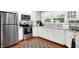 Well-lit kitchen with stainless appliances, granite countertops, and ample cabinet space for storage at 8641 Cholla Rd, Indianapolis, IN 46240