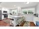 Modern kitchen with white cabinetry, stainless steel appliances, and a stylish breakfast bar, perfect for casual dining at 8641 Cholla Rd, Indianapolis, IN 46240
