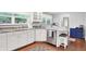 Elegant kitchen with white cabinets, granite countertops, stainless steel appliances, and hardwood floors at 8641 Cholla Rd, Indianapolis, IN 46240