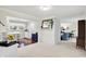 Spacious living room featuring modern, neutral decor, connecting to an adjacent eat-in kitchen and additional rooms at 8641 Cholla Rd, Indianapolis, IN 46240
