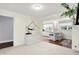 Inviting open-concept layout flows through dining area into a bright kitchen with a breakfast bar and updated appliances at 8641 Cholla Rd, Indianapolis, IN 46240