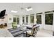 Sunlit living room with vaulted ceilings, large windows, and a seamless connection to the outdoor landscape at 8641 Cholla Rd, Indianapolis, IN 46240