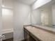 Bathroom featuring a vanity with a stone countertop, framed mirror, and a shower with a tub at 8715 Hollander Dr, Camby, IN 46113
