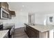 Spacious kitchen features an island with a sink and stainless steel appliances at 8715 Hollander Dr, Camby, IN 46113