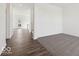 Bright living room with hardwood flooring, neutral carpet and a view towards the entry at 8715 Hollander Dr, Camby, IN 46113