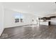 Open-concept living space featuring a stunning kitchen with an island and hardwood flooring at 8715 Hollander Dr, Camby, IN 46113
