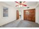 Neutral bedroom with a window and closet, leading to the game room, features light walls and carpet flooring at 8802 W 86Th St, Indianapolis, IN 46278
