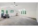 Expansive bonus room with vaulted ceilings, ample natural light, seating, and a TV at 8802 W 86Th St, Indianapolis, IN 46278