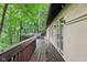 This cozy deck is surrounded by lush trees and features an outdoor seating area, perfect for relaxing at 8802 W 86Th St, Indianapolis, IN 46278