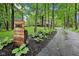 Long driveway leading to home, address displayed on wooden placard, lined with mulch and foliage at 8802 W 86Th St, Indianapolis, IN 46278