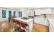 Bright kitchen with island seating, stainless steel appliances, and hardwood flooring at 8802 W 86Th St, Indianapolis, IN 46278
