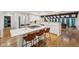 Bright, open concept kitchen with stainless steel appliances, gas range, and eat in barstool seating at 8802 W 86Th St, Indianapolis, IN 46278