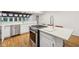 Bright kitchen island with stone countertop, stainless steel appliances, and hardwood flooring at 8802 W 86Th St, Indianapolis, IN 46278