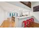 Open concept kitchen and dining area with hardwood flooring and barstool seating at 8802 W 86Th St, Indianapolis, IN 46278