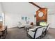 Bright living room with fireplace, wood beam, white couch, and large windows at 8802 W 86Th St, Indianapolis, IN 46278