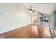 Spacious living room featuring hardwood floors, a ceiling fan, and large windows for ample natural light at 8802 W 86Th St, Indianapolis, IN 46278