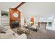 Bright living room with fireplace, wood beam, white couch, and large windows at 8802 W 86Th St, Indianapolis, IN 46278