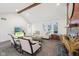 Bright living room with fireplace, wood beam, white couch, and large windows at 8802 W 86Th St, Indianapolis, IN 46278