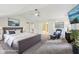 Bright primary bedroom boasts vaulted ceilings, a ceiling fan, and stylish furniture for a contemporary design at 8802 W 86Th St, Indianapolis, IN 46278