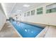 Long indoor swimming pool with skylights and large windows, providing a bright and inviting space at 8802 W 86Th St, Indianapolis, IN 46278