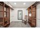 Spacious walk-in closet with custom shelving, carpet and an ornate accent chair at 8802 W 86Th St, Indianapolis, IN 46278