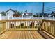 Inviting backyard with wood deck, a well-maintained fence, and lovely landscaping at 918 S State Ave, Indianapolis, IN 46203