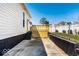 Well-kept backyard with wood deck, a fenced yard, and access to the home at 918 S State Ave, Indianapolis, IN 46203