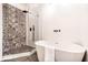 Modern bathroom featuring a standalone tub and a glass-enclosed shower with stylish patterned tile at 918 S State Ave, Indianapolis, IN 46203