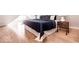 Cozy bedroom with wood floors and a comfortable bed under sloped ceilings at 918 S State Ave, Indianapolis, IN 46203