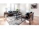 Comfortable living room with stylish seating, a decorative rug, and natural light from large windows at 918 S State Ave, Indianapolis, IN 46203