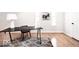 Bright office with modern decor features wood floors, a desk, and natural lighting at 918 S State Ave, Indianapolis, IN 46203