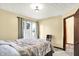 Bedroom featuring a full sized bed, closet and doorway to another room, and a large window at 926 Brookside Ln, Plainfield, IN 46168